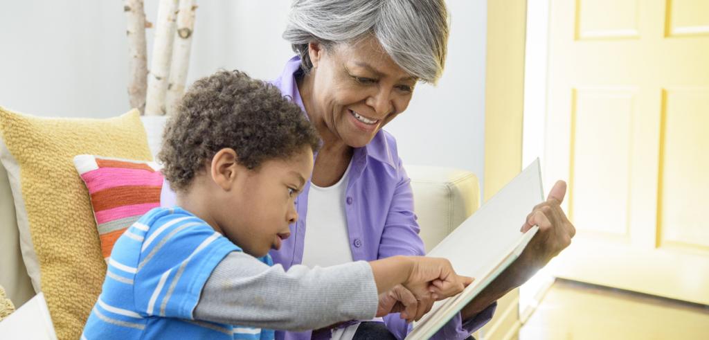 African American grandmother reading with grandson African American grandmother reading with grandson