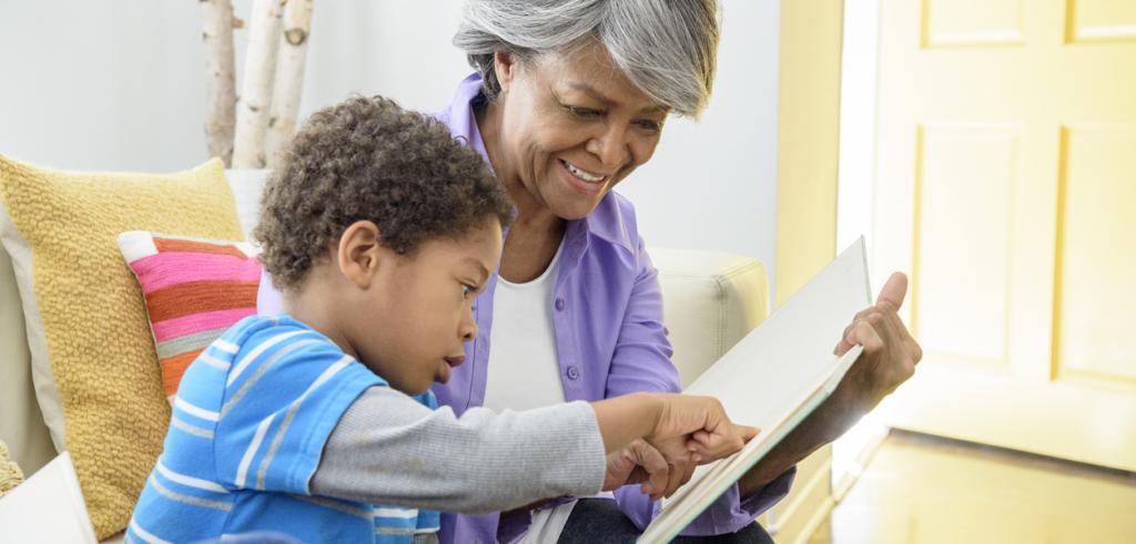 African American grandmother reading with grandson African American grandmother reading with grandson