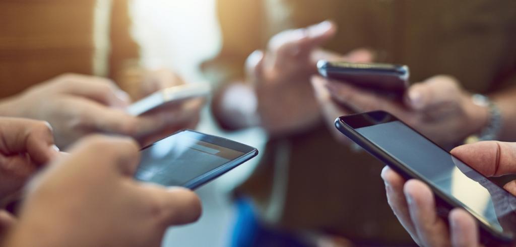 Business people on smartphones Business people on smartphones