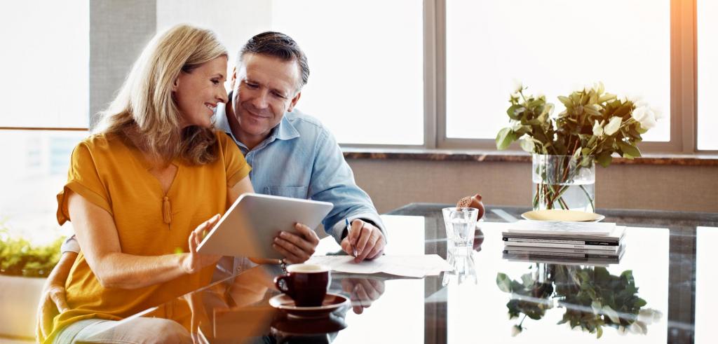 Couple using tablet Middle aged couple looking at their tablet