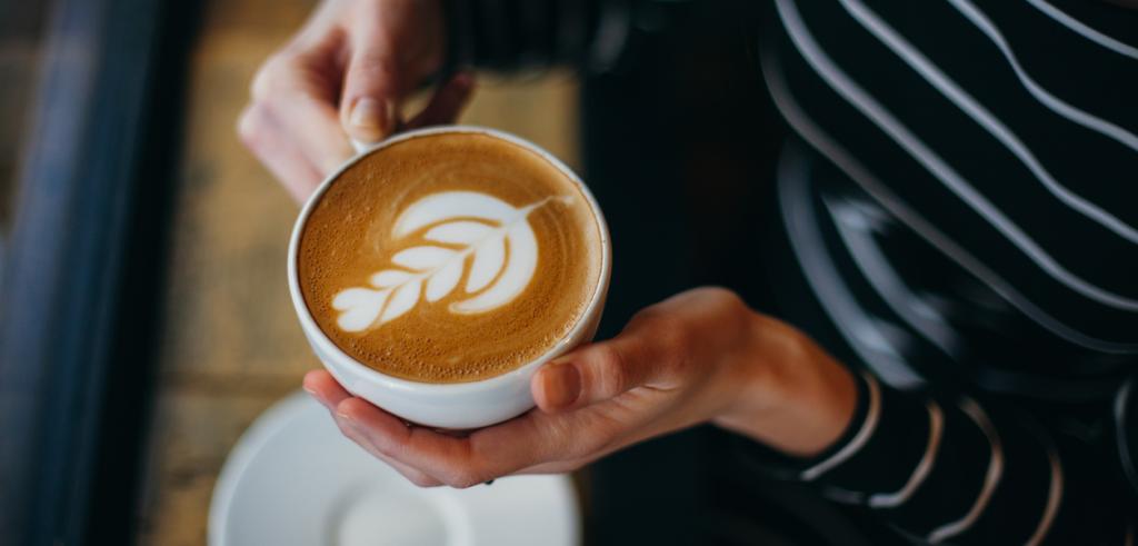 Cup of coffee in women's hand Cup of coffee in women's hand