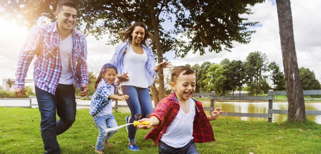 Family having fun playing in the park