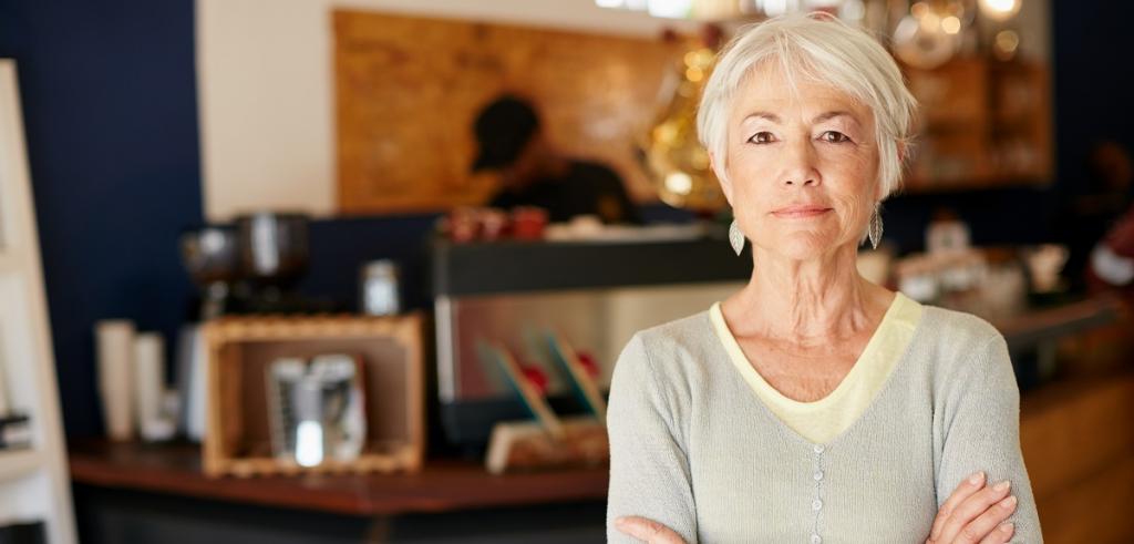 Retired Woman Retired woman standing in living room