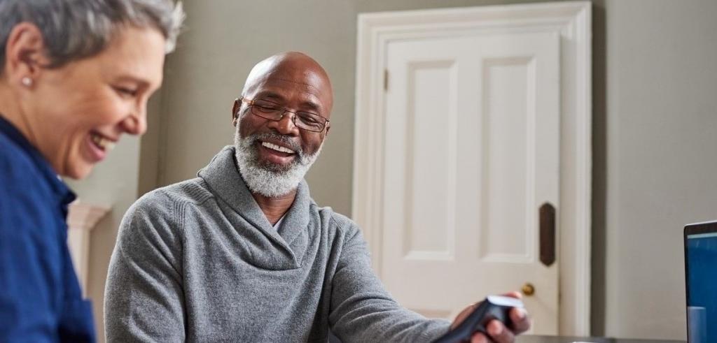 Retired couple reviewing financial statements and wealth plan Retired couple reviewing financial statements and wealth plan