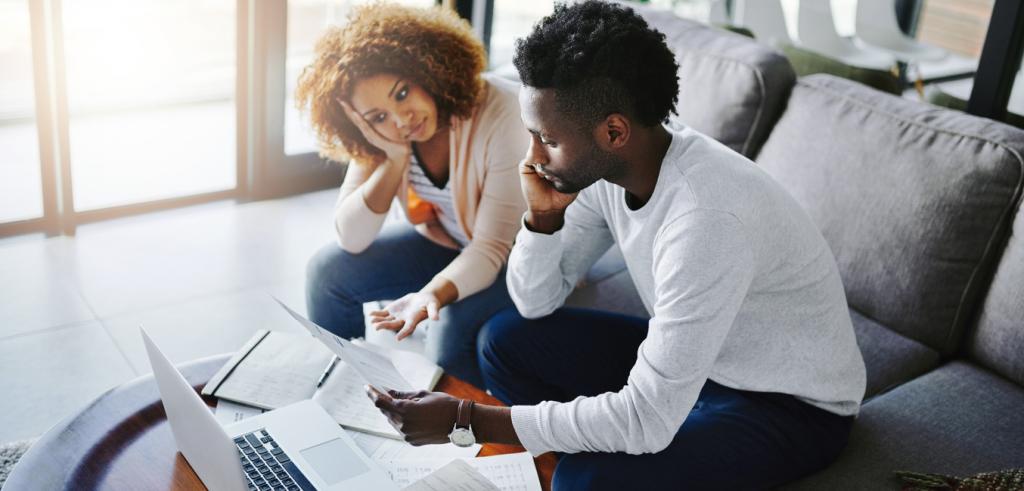 Stressed couple Stressed couple reviewing financial statement