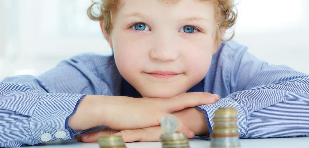 Young boy money Young boy looking at money
