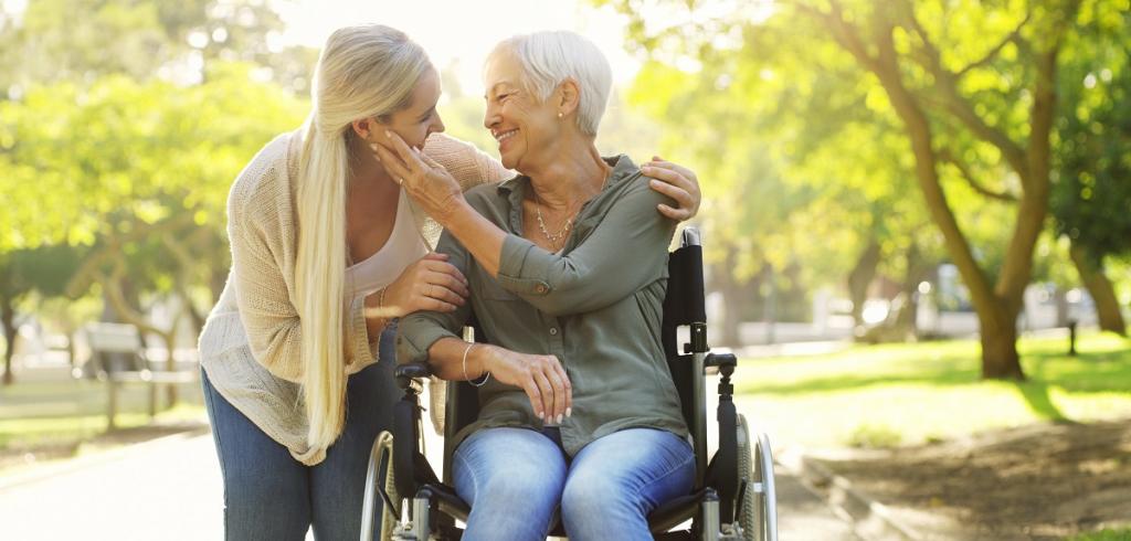 mother and adult daughter daughter caring for her mother