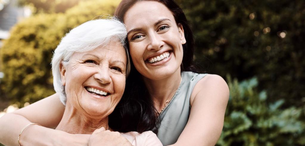 Mother and daughter Adult daughter embracing mother
