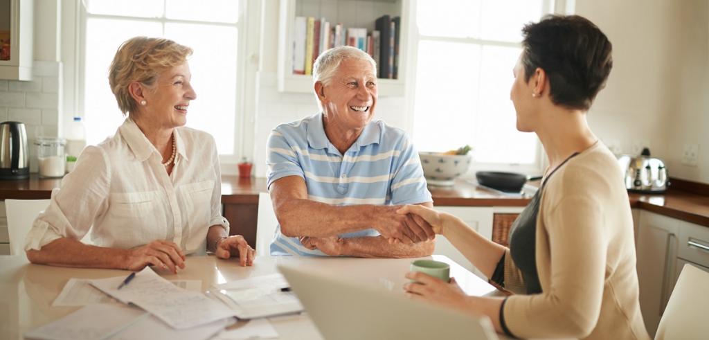 Retired couple financial advisor Retired couple meeting with financial advisor