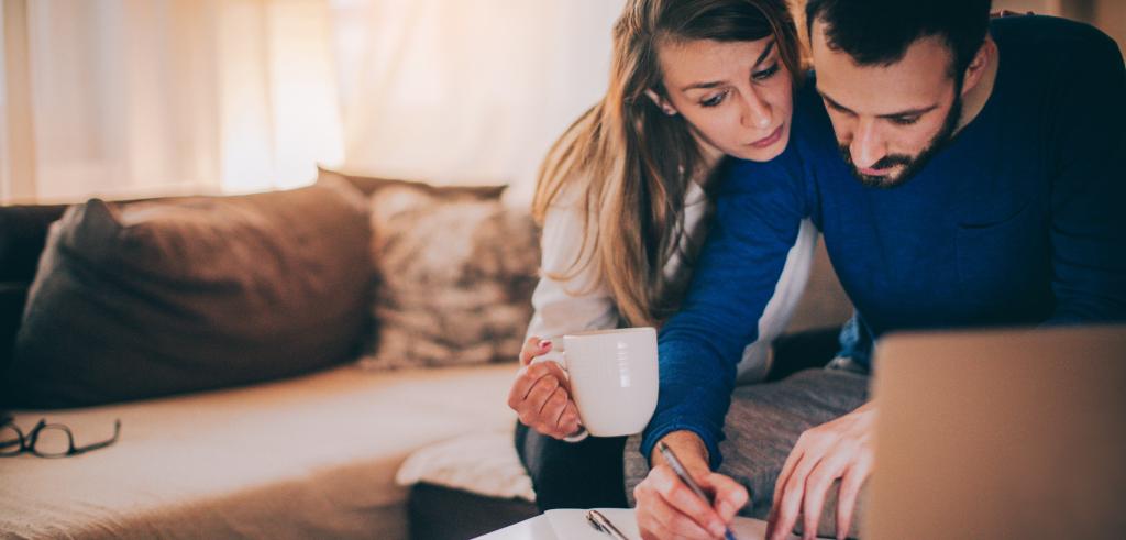 Couple reviewing finances and paper work.jpg Couple reviewing finances and paper work.jpg