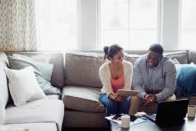 Couple reviewing financial statements