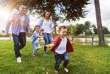 Family having fun playing in the park