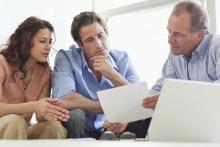 Financial Advisor reviewing retirement plan with clients