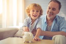Grandparent teaching grandchild important money management skills