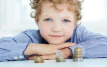 Young boy looking at money