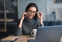 woman on her phone and laptop